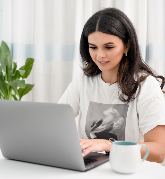 Free photo woman working as freelancer from home