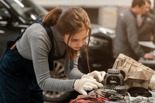 Woman working at a car service