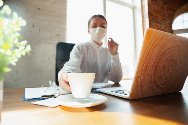 Woman working from home during coronavirus or COVID-19 quarantine