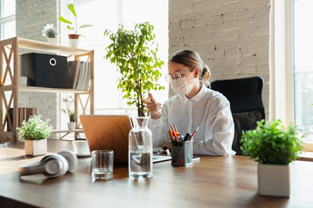 Woman working from home during coronavirus or COVID-19 quarantine