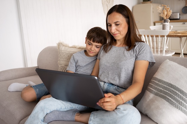 Woman working from home with kid side view