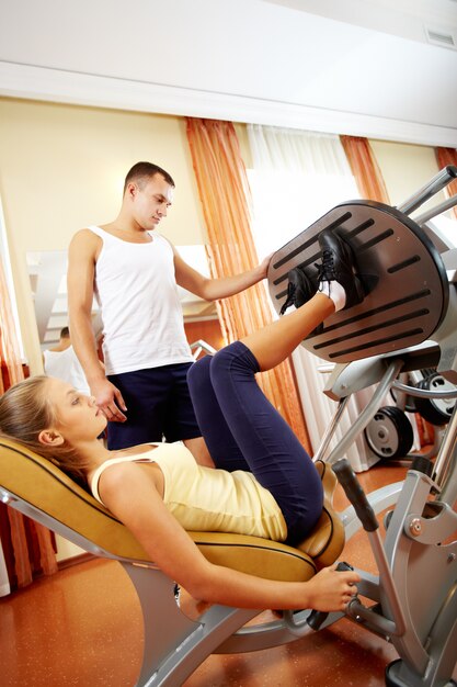 Woman working her legs at the gym