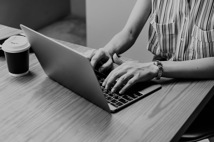 Free Photo woman working on a laptop
