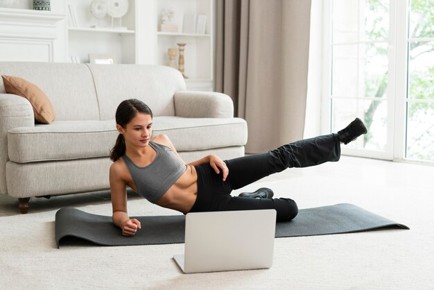 Woman working out alone at home