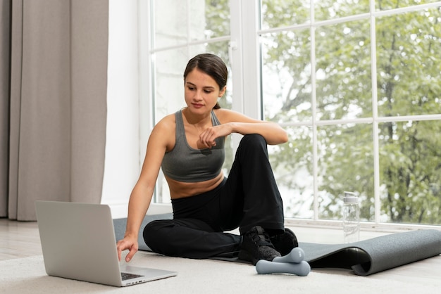 Woman working out alone at home