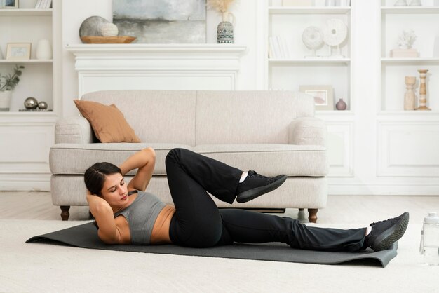 Woman working out alone at home