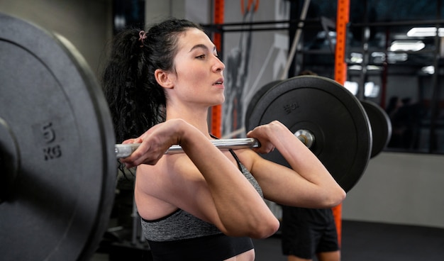 Woman working out indoors with weights