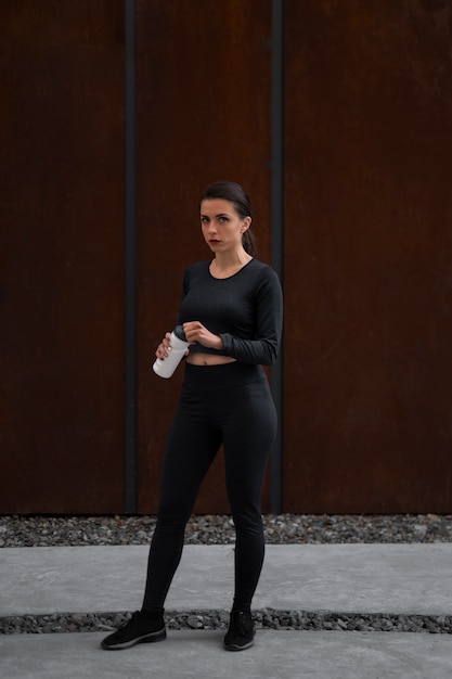 Free photo woman working out outdoors alone