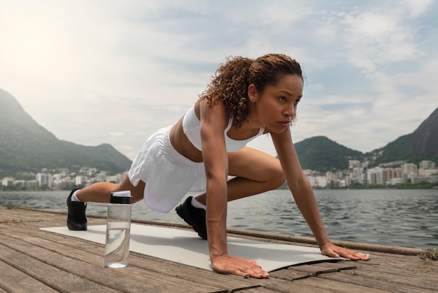 Free photo woman working out outdoors alone