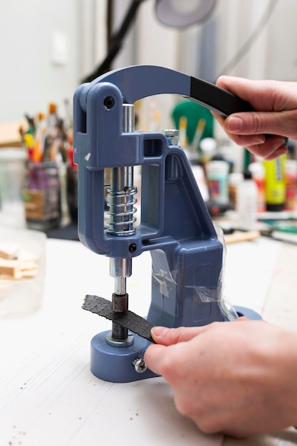 Woman working at sewing machine close-up