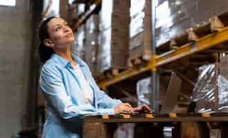 Free photo woman working in warehouse