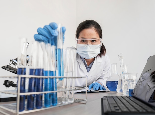 Woman working with chemical substances in lab