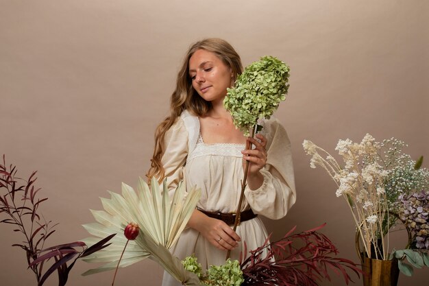 Free photo woman working with dried plants medium shot