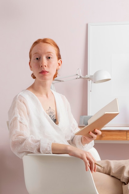 Woman at workplace reading