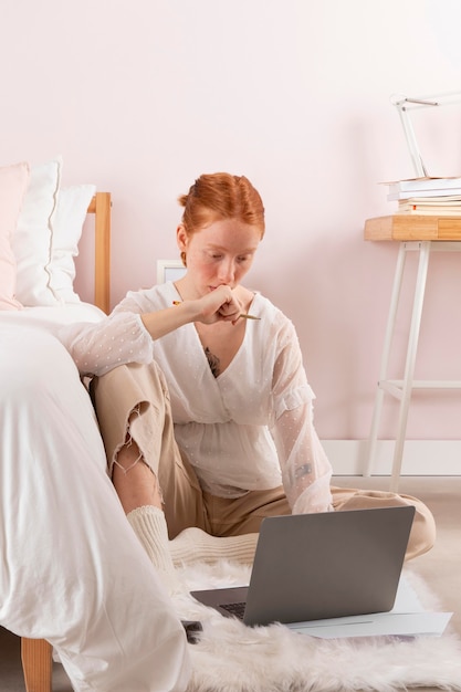 Woman at workplace using laptop