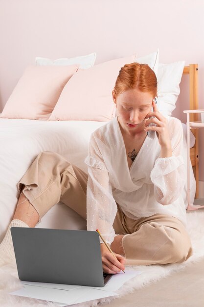 Woman at workplace using laptop