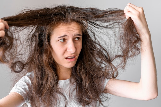 Woman worried about tangled hair
