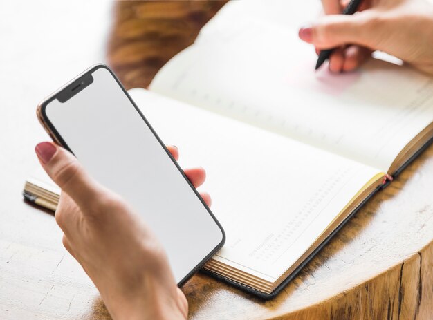 Woman writing from phone mock-up