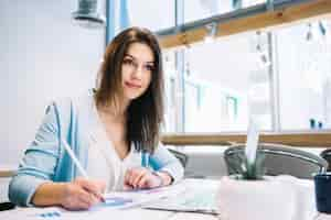 Free photo woman writing notes