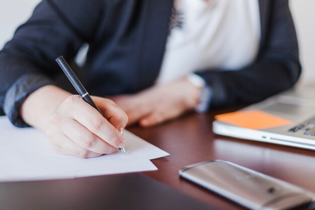 Woman writing in office