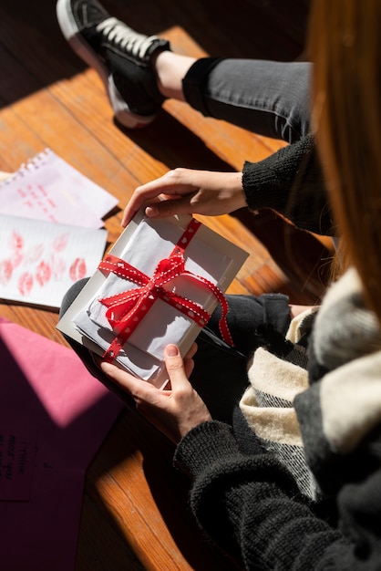 Woman writing a romantic love letter to someone