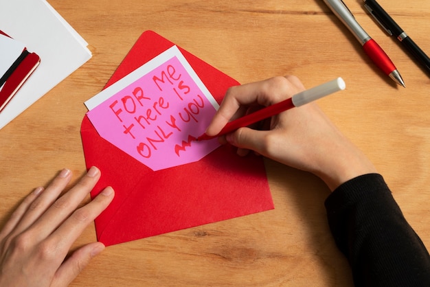 Woman writing a romantic love letter to someone