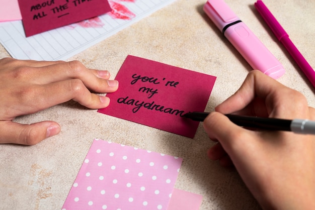 Woman writing a romantic love letter to someone