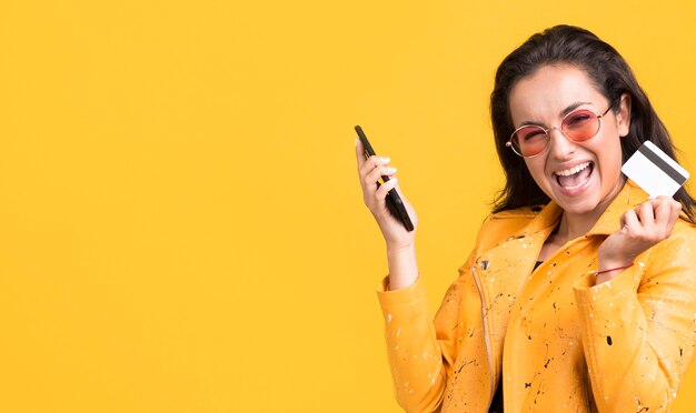 Woman in yellow jacket being happy copy space