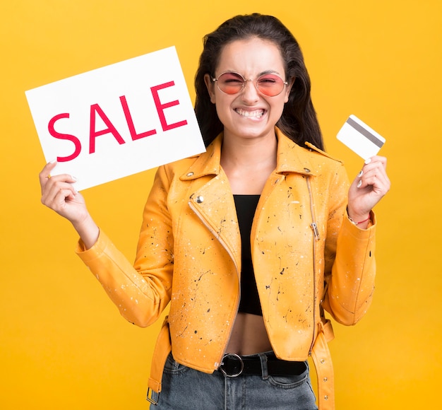 Free photo woman in yellow jacket front view black friday concept