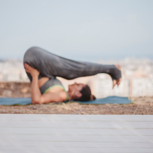 Woman in yoga pose outdoors