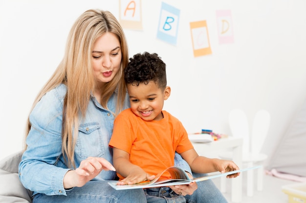 Woman and young boy looking at home