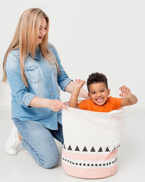 Free photo woman and young boy posing together