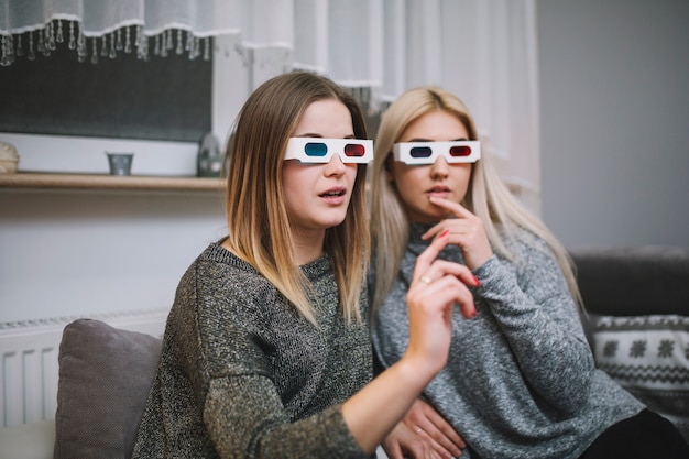 Free photo women in 3d glasses watching film