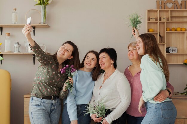 Women of all ages taking a self photo