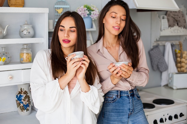 Free photo women on break enjoying coffee