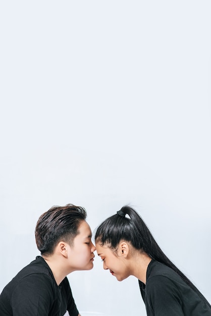 Free photo women couples stand and fragrant cheek.