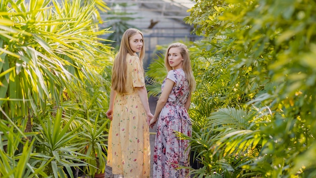 Women in dresses looking backwards