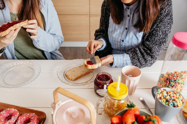 Women eating toasts for breakfast