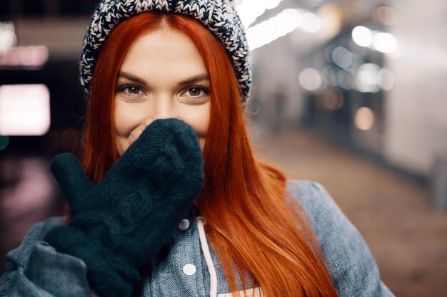 Women enjoy winter holiday lights in the evening