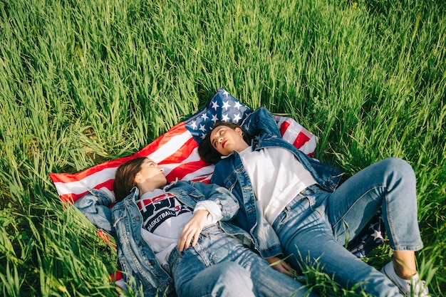 Women on grass looking each other