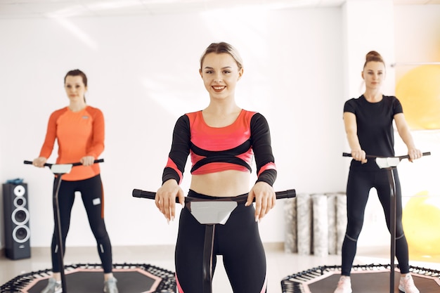 Women group on sport trampoline. Fitness workout.