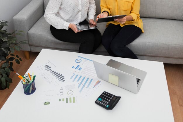 Women hands holding a tablet and a clipboard