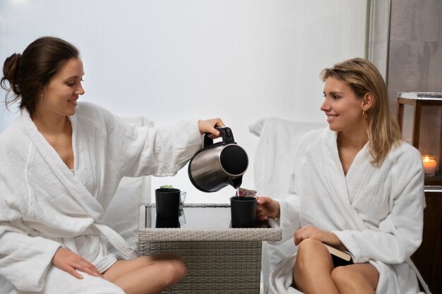 Women having beauty treatment at sauna