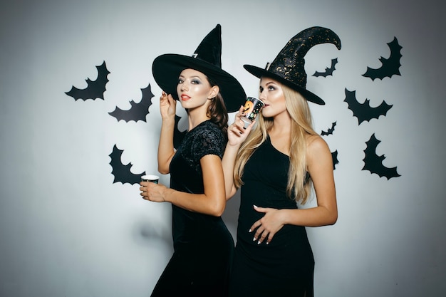 Free photo women having drinks on halloween party