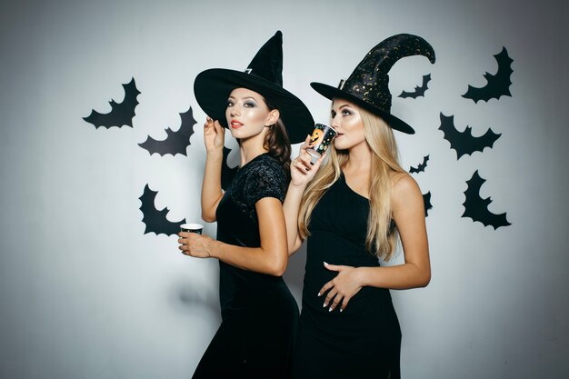 Women having drinks on Halloween party