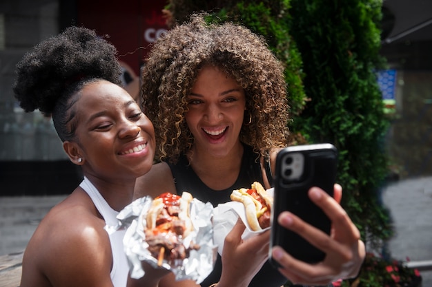 Free photo women having fun at food festival