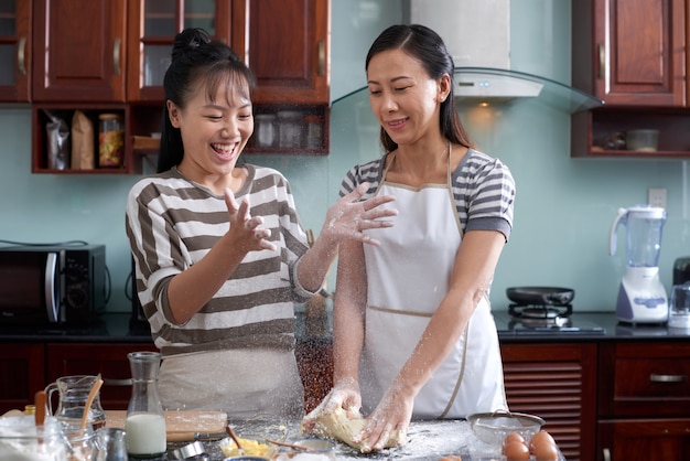 Women having fun in kitchen