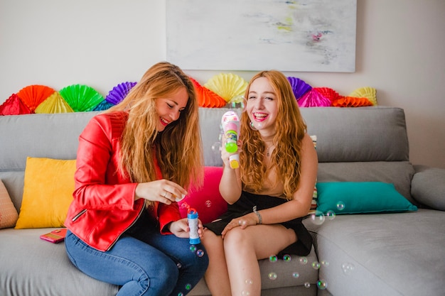 Women having fun with soap bubbles