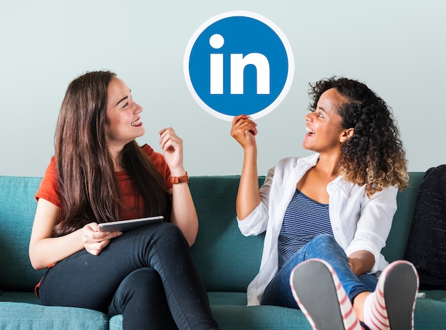Women holding a Linkedin logo
