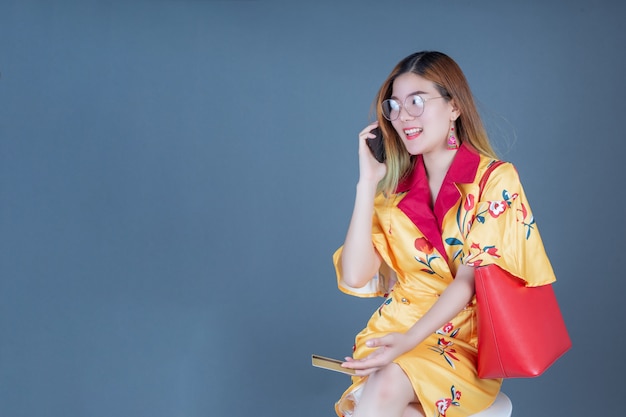 Women holding smart cards and mobile phones